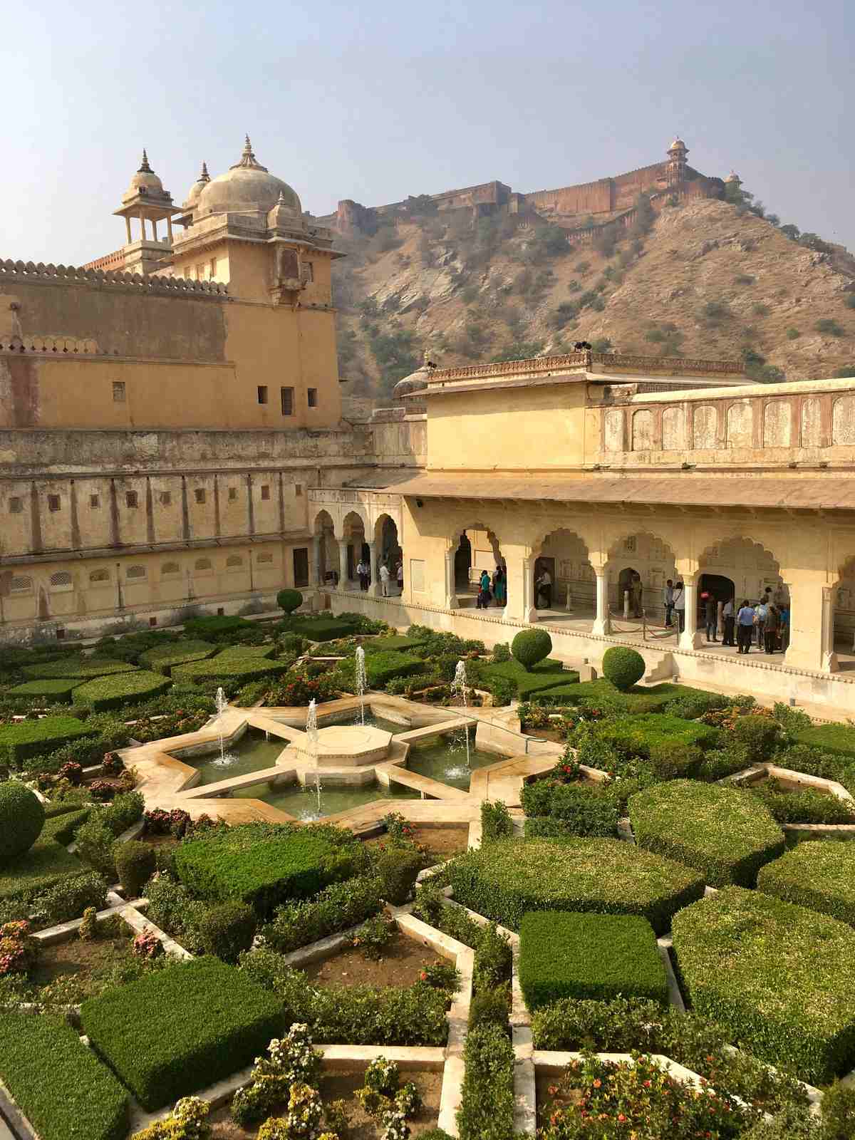 Manicured star-shaped Mughal gardens with fountains inside Amber Fort Jaipur